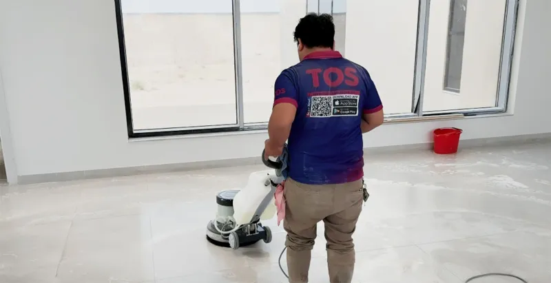 TopOne team machine-scrubbing the floor of a Dubai villa
